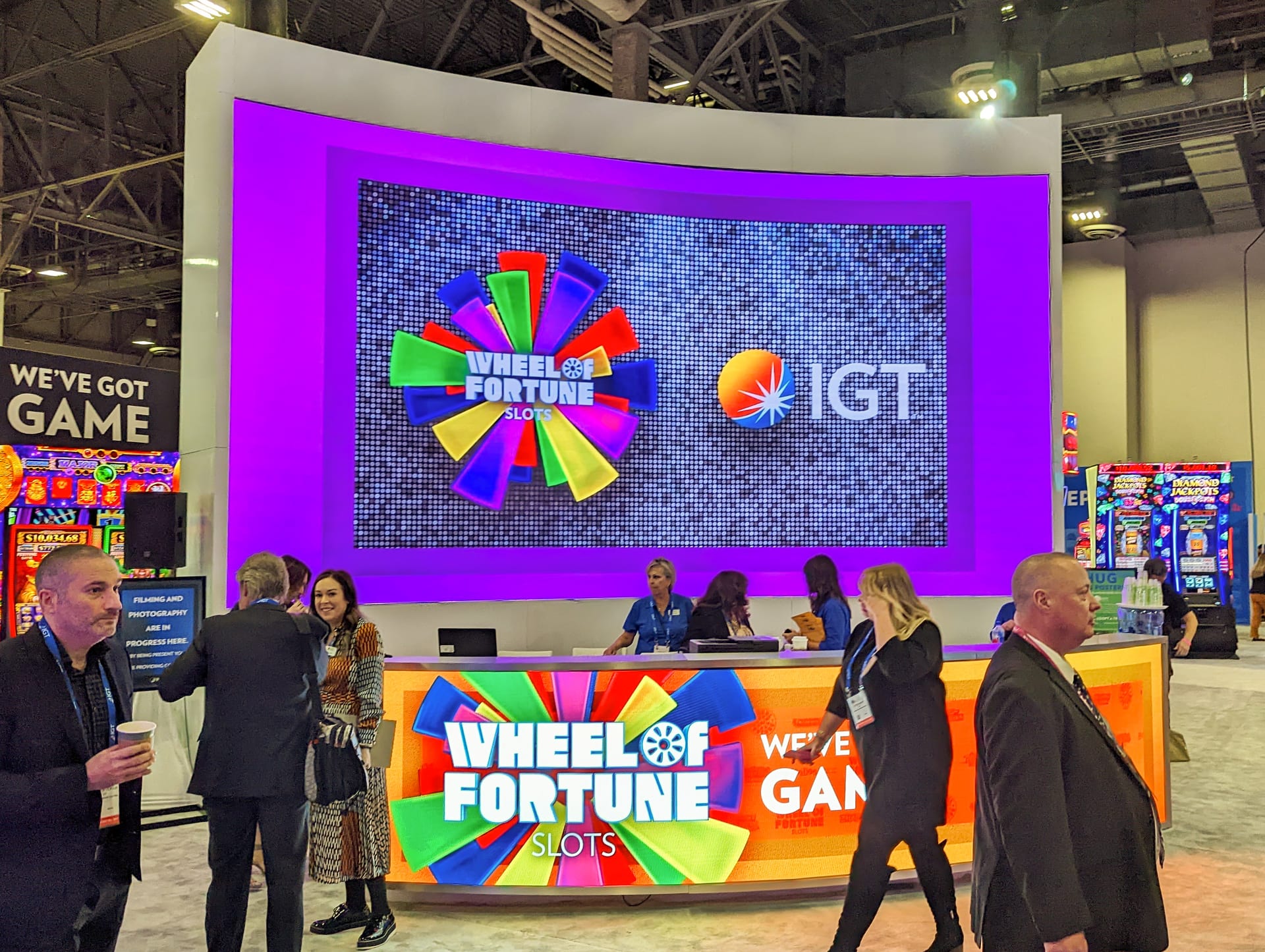 The Wheel of Fortune game lit up at the We've Got Game counter in IGT's booth at G2E 2022