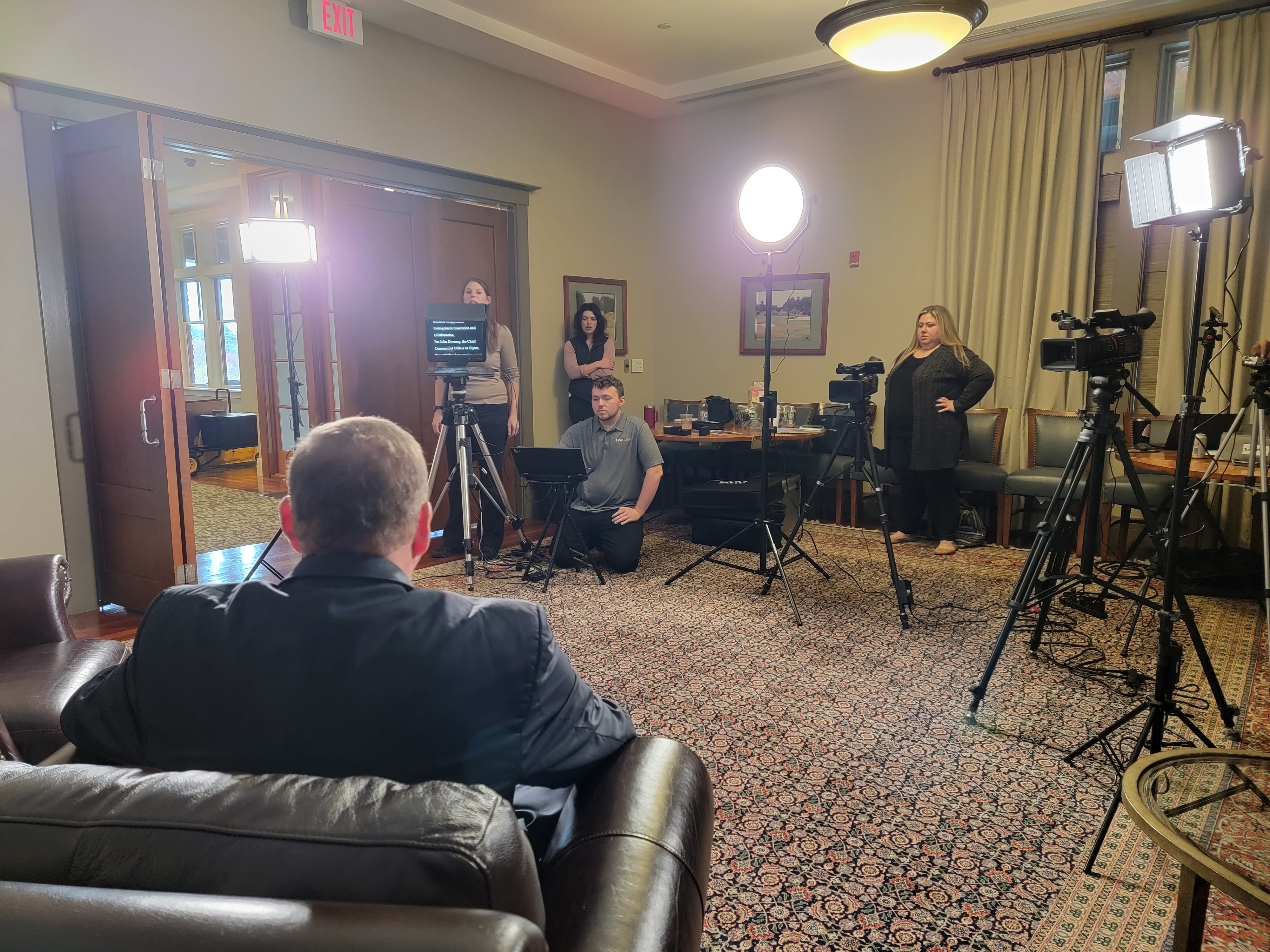 A multi-camera shoot in a luxurious clubhouse.