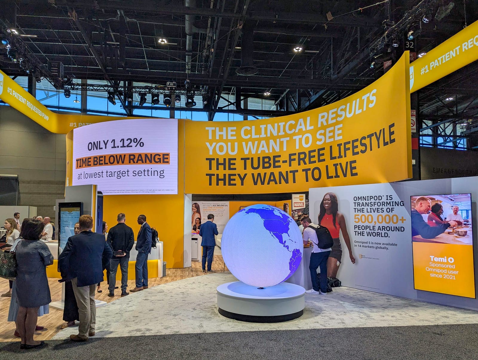 Insulet's Omnipod booth with a glowing LED globe at ADA 2025
